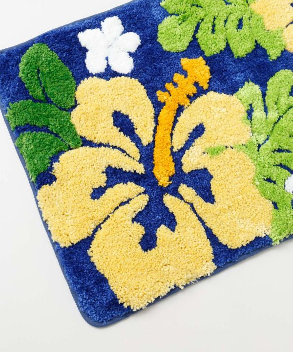 ブルーカラーのハイビスカスとAlohaロゴが描かれたハワイアンパイルマット